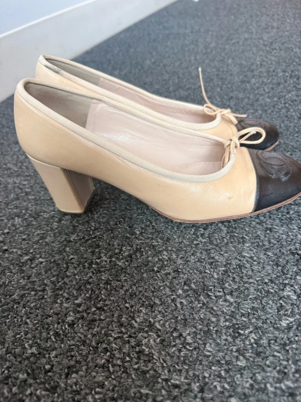 CHANEL Two-Tone Beige and Black Cap-Toe Leather pumps